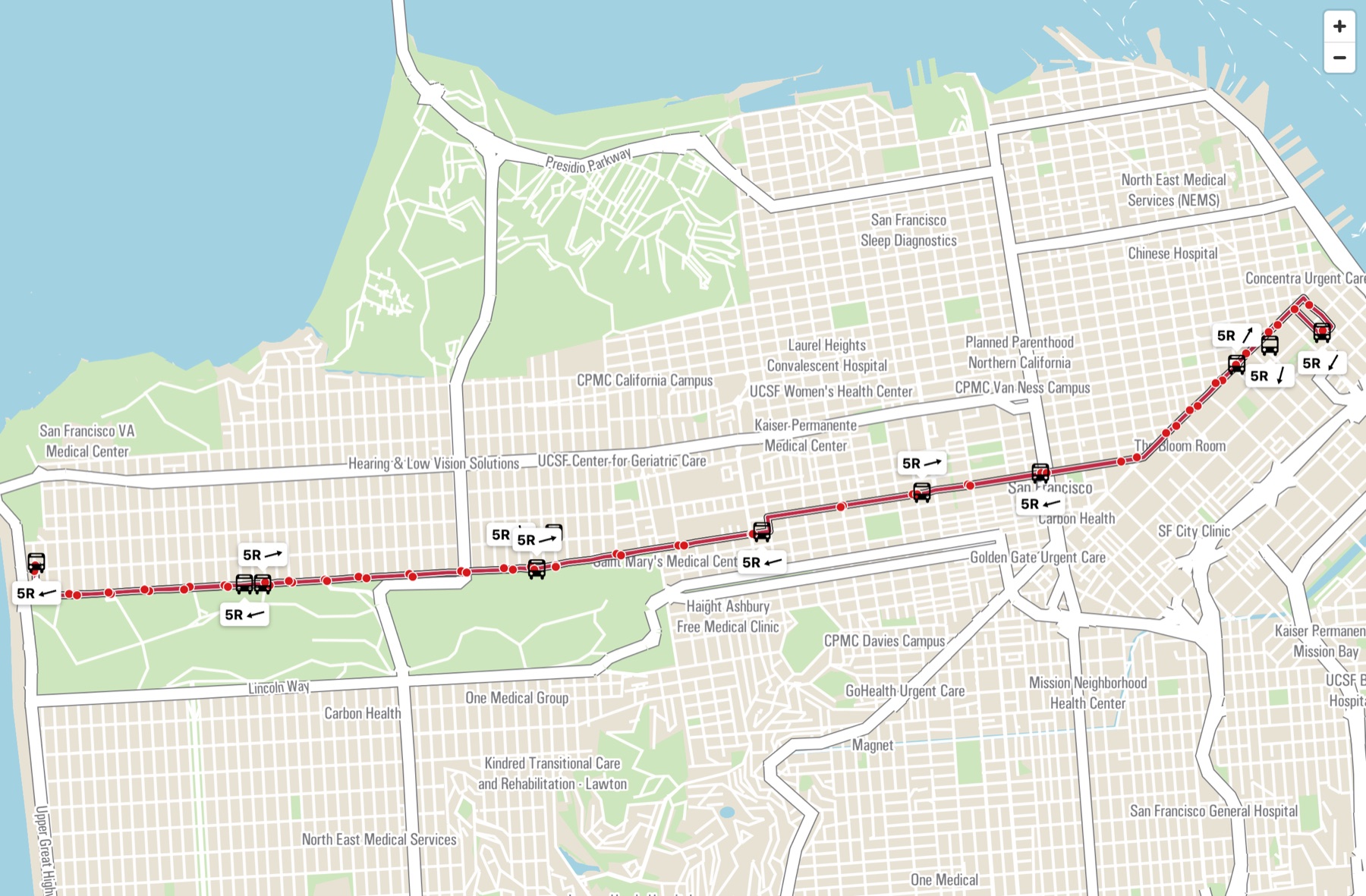 Live vector map of a rapid bus route crossing the city: red route shape with white casing, stop dots, and bus icons with route labels and heading arrows