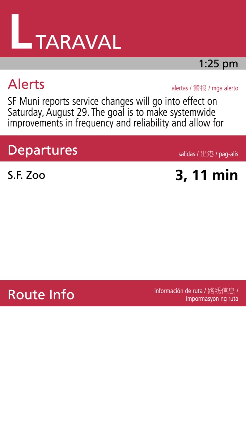 A portrait platform pylon display showing the L Taraval route badge, a service alert, live departures to S.F. Zoo in 3 and 11 minutes, and a route info band, with labels in four languages.
